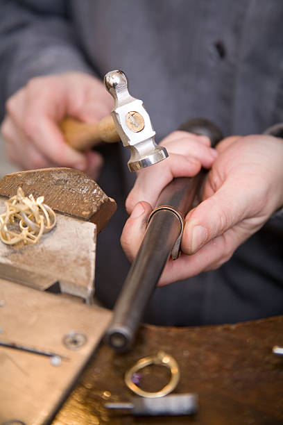 istock A goldsmith smoothing out a ring band 146732024