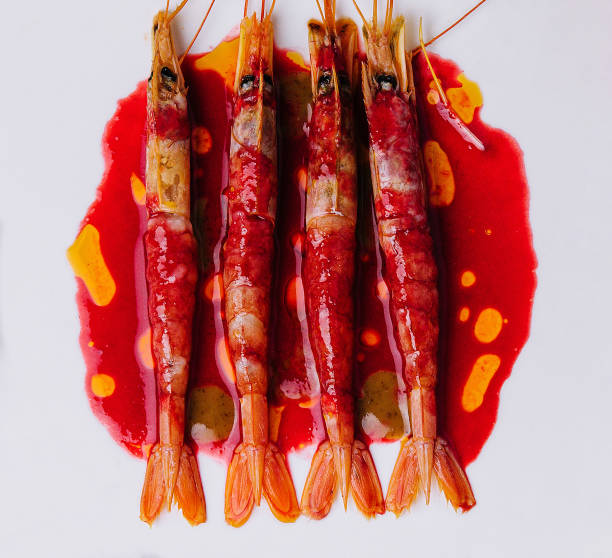 istock Grilled tiger prawns on a ceramic plate, top view 1467320763
