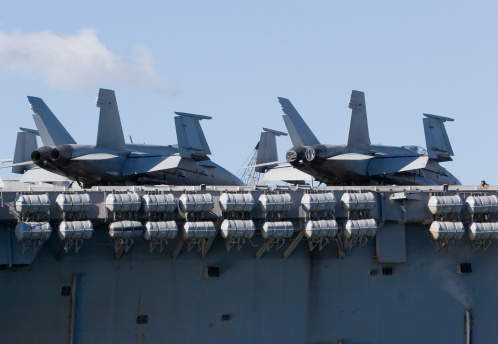 Navy jet fighters on the deck of an aircraft carrier