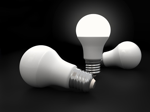 One light bulb only glowing in dark. Digitally generated image