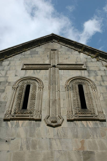 Cross on the church wall stock photo