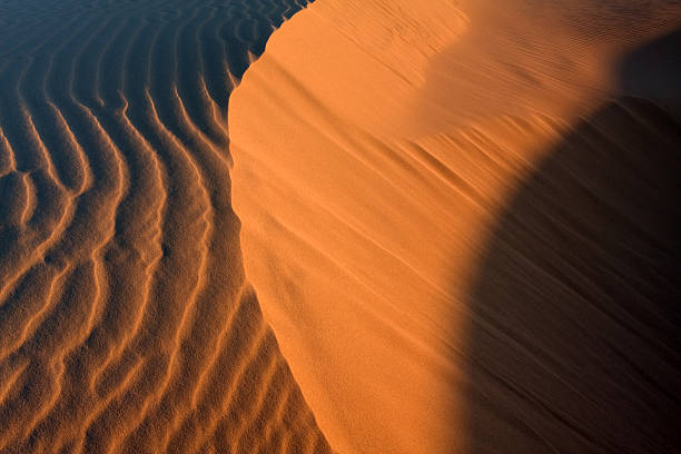 Desert landscape and shadows stock photo