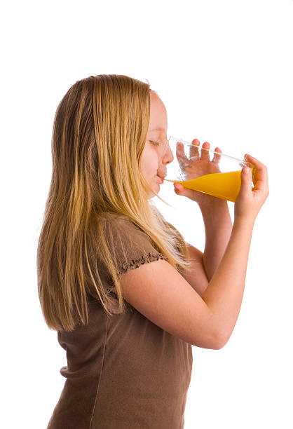 istock Girl Drinking Orange Juice 146732751
