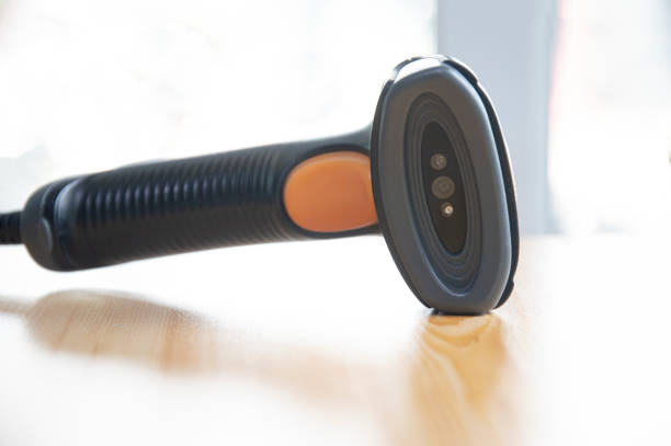 istock barcode scanner placed on a brown wooden floor 1467328218