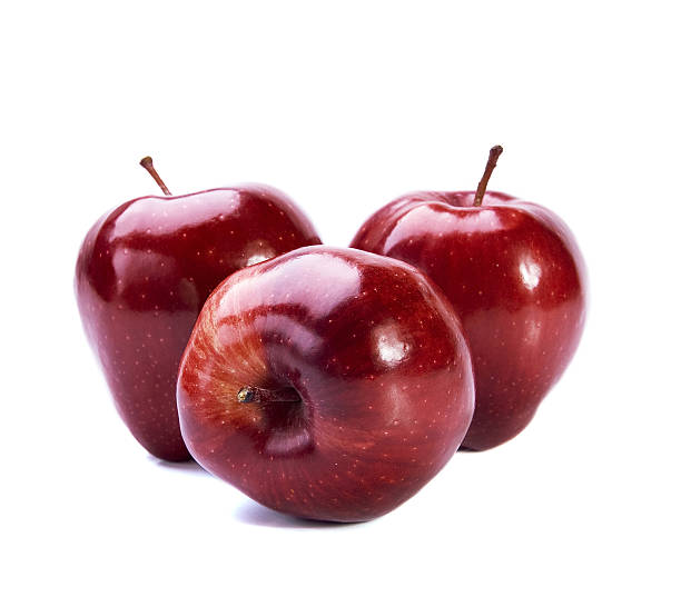 Three red apples on white background stock photo