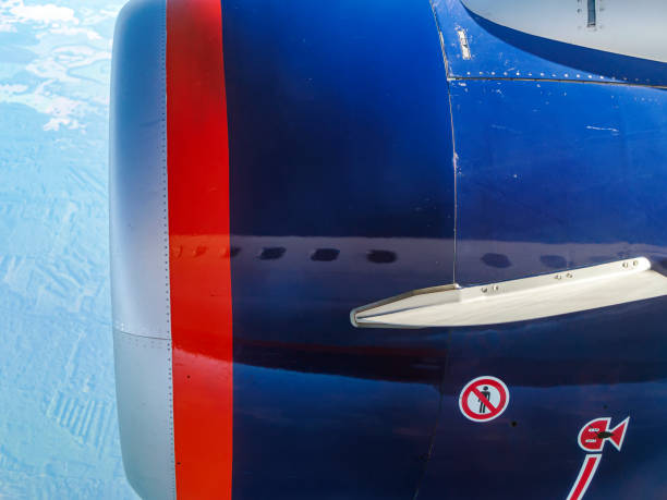 istock View to the engine of airplane through a cabin window during the flight. 1467328896