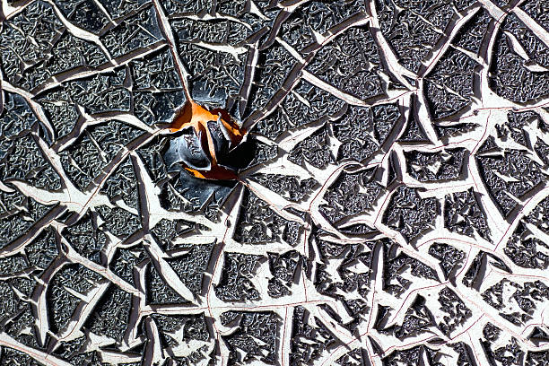 Cracked chipped black paint on metal stock photo