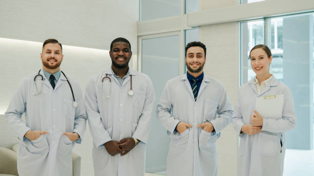 istock Team of Doctors Standing in a Row and Looking at Camera. 1467331705
