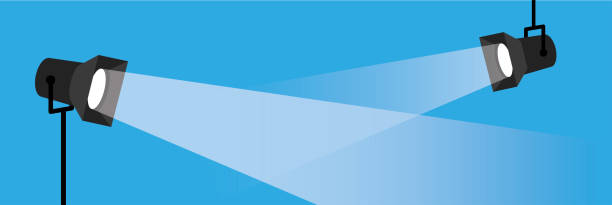 illustrations, cliparts, dessins animés et icônes de bannière deux projecteurs . spot plat vectoriel sur fond bleu. illustration eps10. - projecteur