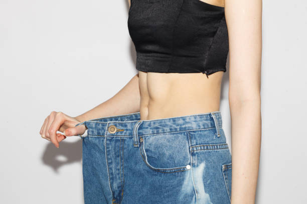 istock perfect female abs, healthy diet concept 1467333782