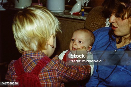 istock Toddler boy with baby brother 1467338388