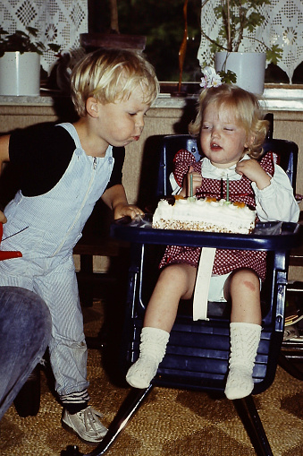 Little brother and sisters back in the eighties on a birthday party