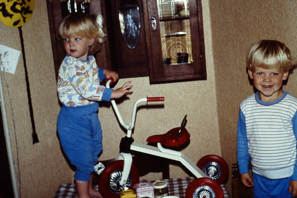 Little brother and sisters back in the eighties at a birthday party