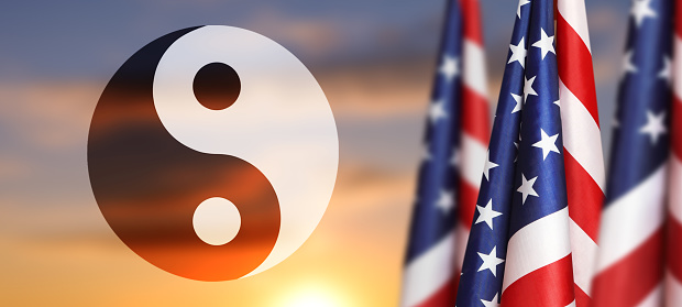 USA flag and symbol of Buddhism on sky background. National Religious Freedom Day