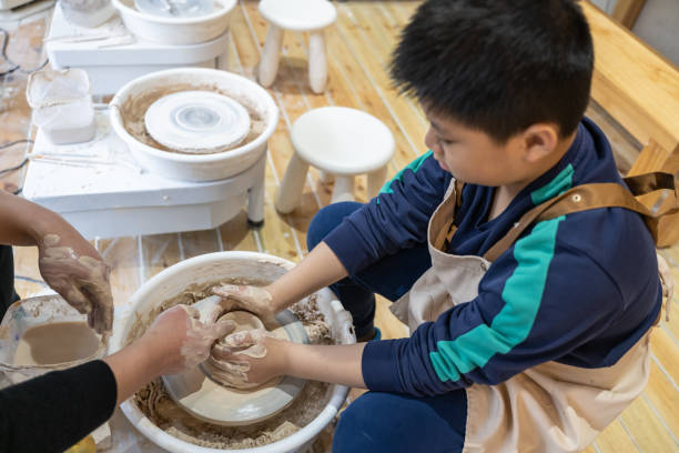 istock A little boy is learning to make handmade pottery 1467342006