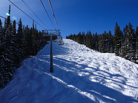 Ski lift view of a steep mogul run at Snowmass ski resort Aspen, Colorado.