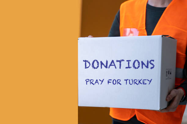 volunteer carrying donation box