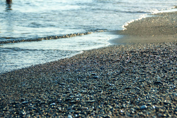 Water rolling over stones on a stony beach