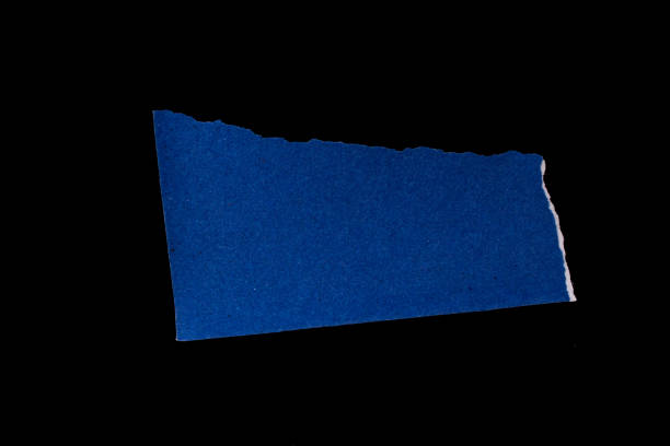 istock Ripped paper on black background 1467349796