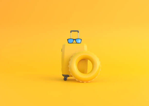 istock Suitcase, glasses and inflatable circle on a yellow background with copy space 1467350023