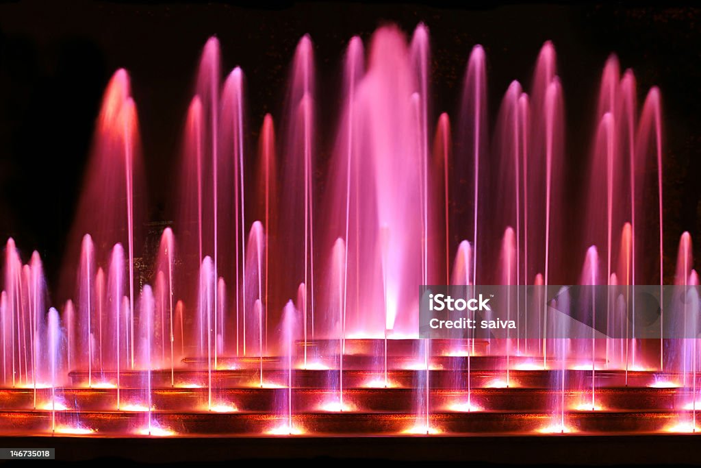 magic water fountain water fountain in purple color Beauty In Nature Stock Photo