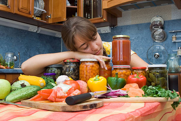 Girl tired after cooking Girl sleeping with vegetables pattyson stock pictures, royalty-free photos & images