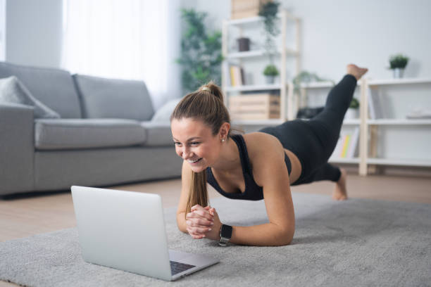 istock Young woman on a virtual fitness class 1467352648