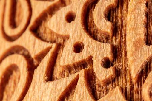 This high-resolution macro close-up of an intricate wood texture provides a stunning display of the natural beauty of this material. The photo captures a detailed view of the grain, with the varied colors, shapes, and shadows of the wood providing a captivating visual. Perfect for use in home decor, design, and architecture projects, this image will bring a unique, organic touch to any project.