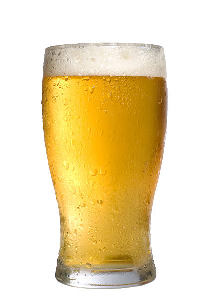 istock Ice cold beer pint glass over white background 146735497
