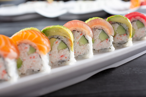 A closeup view of a rainbow roll.