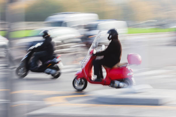 istock Scooter riders in heavy city traffic 1467358396