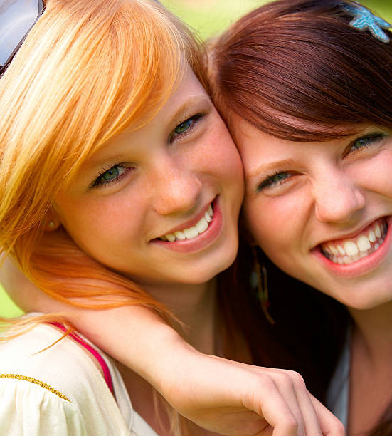 istock Close-up of happy young sisters 146736108