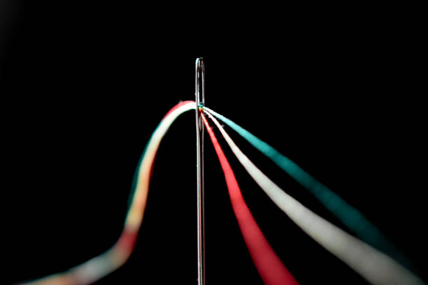 istock a needle and different colors of thread 1467361261