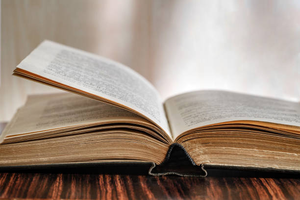 istock Book open old, black cover, close-up, selective focus 1467361534