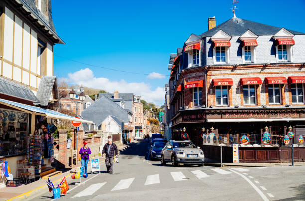 Etretat, France - April, 03 2022: Looking west along Rue Notre Dame in the town of Etretat on the Normandy coast of France.