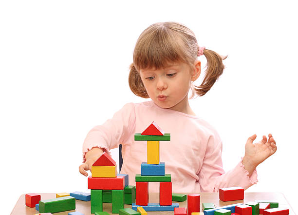 istock Little girl playing with colorful blocks 146736422