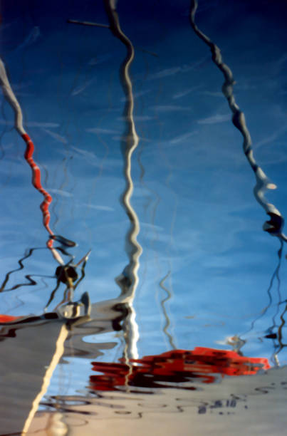 Vigo harbor marina, old port, moored sailing boat reflected, Galicia, Spain.