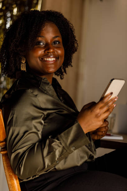 istock Young woman on a coffee break responding to text messages 1467370824