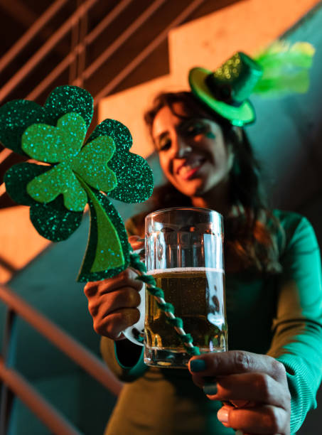 istock Clover and beer in foreground at Saint Patrick's day celebration 1467371639