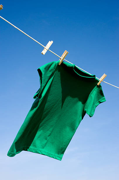 child's clothes, which is in the hands of a woman hoo is going to wash it