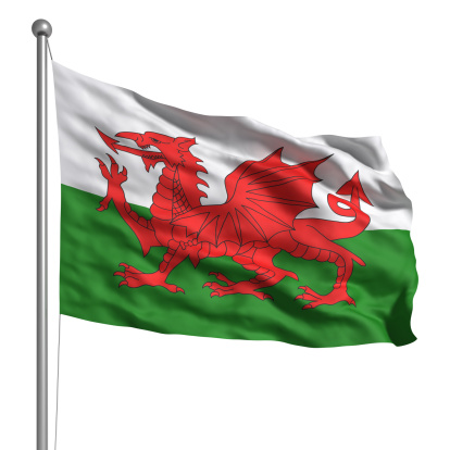 Wales, welsh, United Kingdom flag on flagpole waving isolated on white background realistic 3d illustration