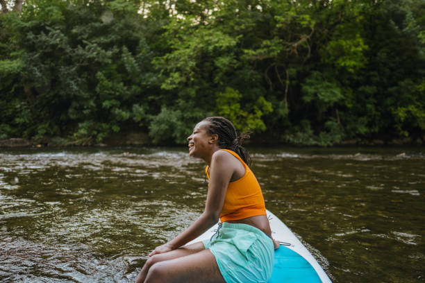 istock Woman and her standup paddleboard 1467375524