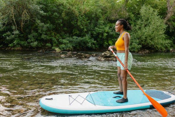 istock Woman on standup paddleboard 1467375529