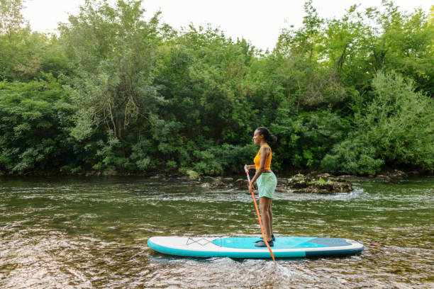 istock Woman on standup paddleboard 1467375546