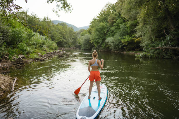 istock Woman on standup paddleboard 1467375566