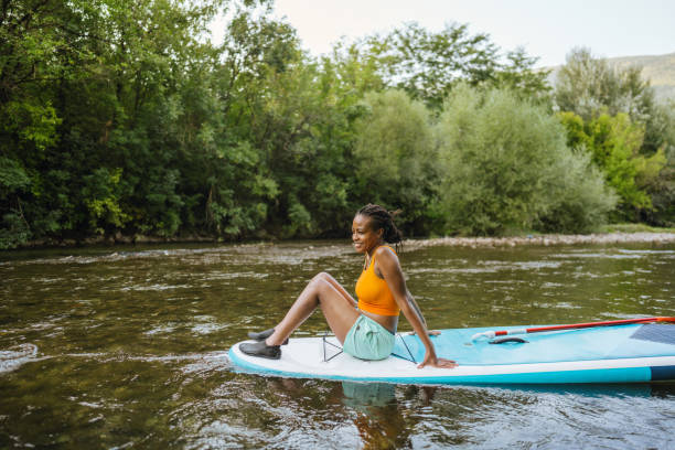 istock Woman and her standup paddleboard 1467375573