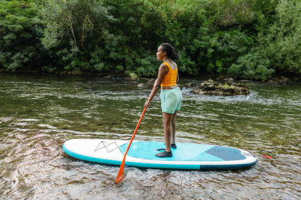 istock Woman on standup paddleboard 1467375586