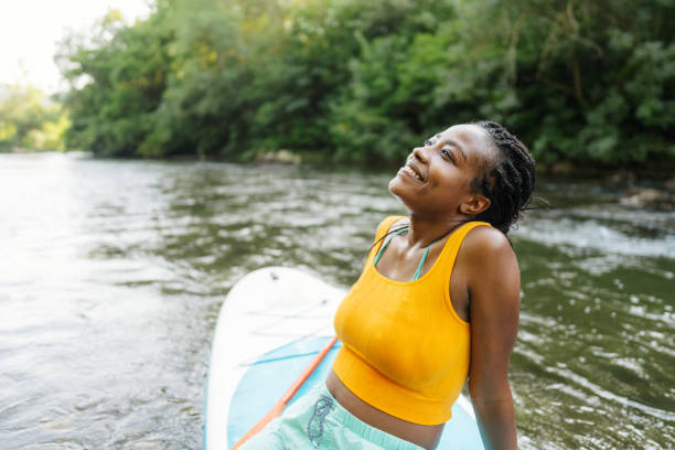 istock Woman and her standup paddleboard 1467375601