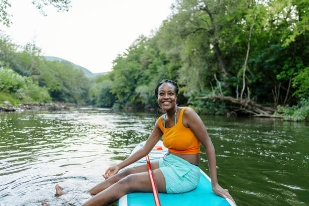 istock Woman and her standup paddleboard 1467375611
