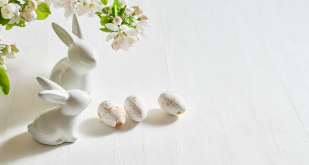 istock Holiday composition with spring flowers and easter eggs, white bunny on a light background. Happy easter concept with copy space 1467375872